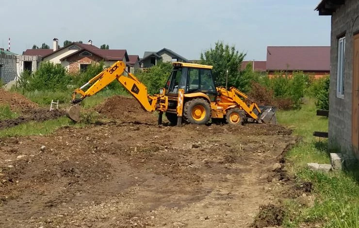 Выравнивание участка перед строительством